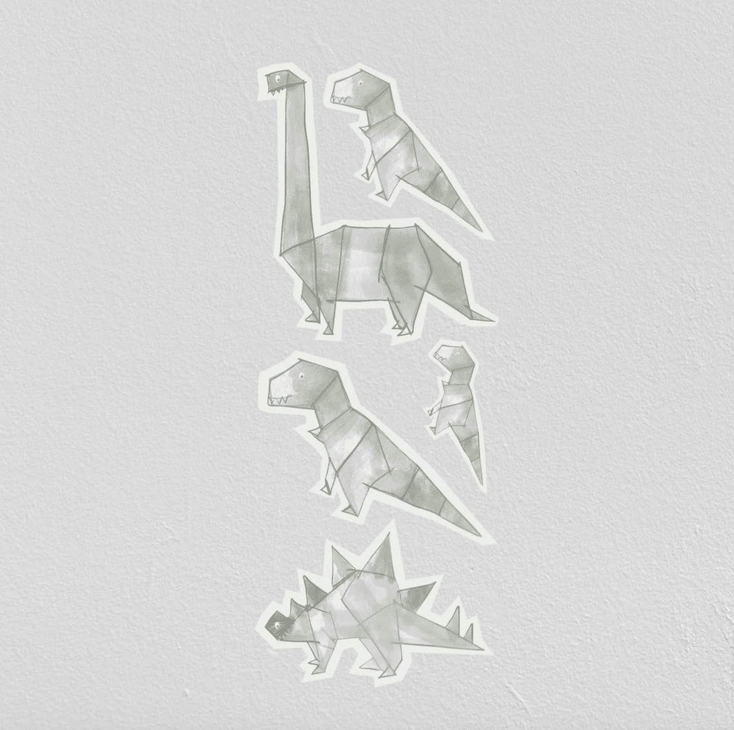Os nossos autocolantes dinossauros aplicados numa parede.